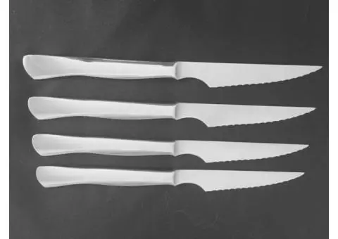 Set of 4 J.A. Henkels High Carbon Stainless Serrated Steak Knives